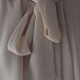Loose fit ruffle tie blouse beige - fasfas