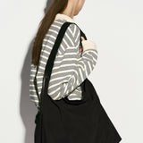 Borsa hobo in pelle di mucca con tracolla nera