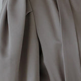 V-neck tie drape unbalanced one-piece