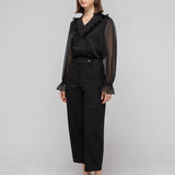 Blouse noire en chiffon à volants et col en V