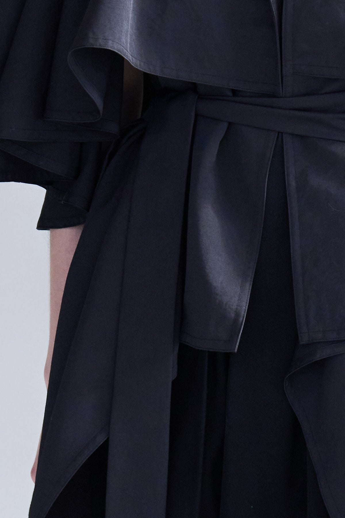 Loose fit cutout cape sleeve asymmetric trench coat black - fasfas