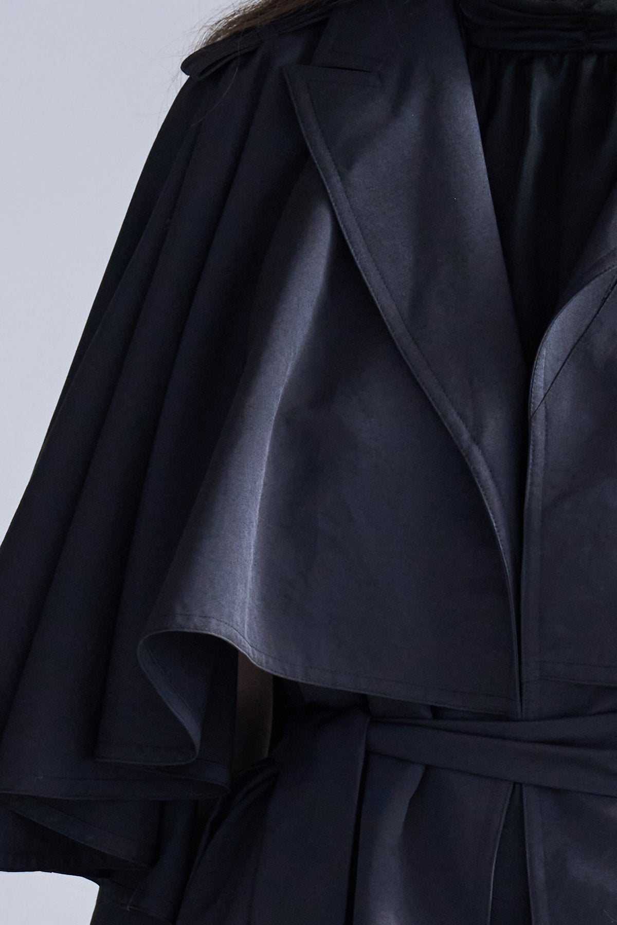 Loose fit cutout cape sleeve asymmetric trench coat black - fasfas