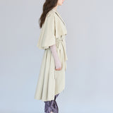 Loose fit cutout cape sleeve asymmetric trench coat - fasfas