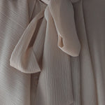 Loose fit ruffle tie blouse beige - fasfas