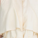 Cutout cape sleeve asymmetric silk trench coat vanila - fasfas