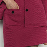 Mini-jupe en tweed chevron diagonal mélangé à la laine rose